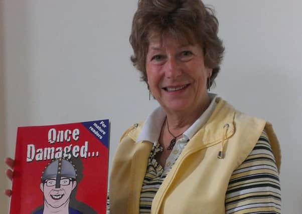 Jane Vrettos with a copy of Once Damaged