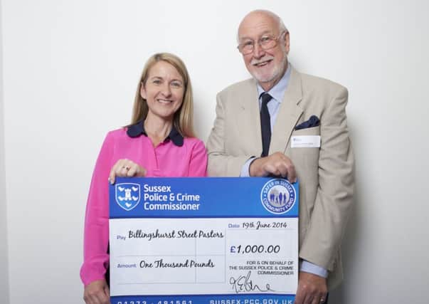 Patrick Perks BEM from Billingshurst Street Pastors receiving a cheque from Sussex Police & Crime Commissioner, Katy Bourne SUS-141107-102552001