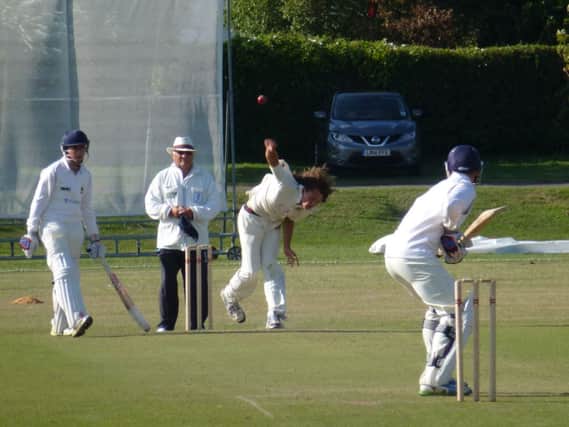 Joe Cox bowling for Bexhill during their amazing win over the Sussex Development XI on Sunday. Picture by Simon Newstead (SUS-140607-210403002)