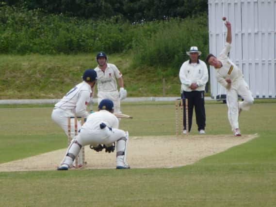 Elliot Hooper, pictured here bowling against Horsham last month, took four wickets for Hastings Priory in their narrow defeat against Brighton & Hove