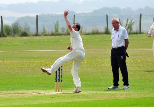 Paul Brookes bowling for Crowhurst Park during their league victory at home to Chichester Priory Park on Saturday. Picture by Steve Hunnisett (SUS-141207-174402002)