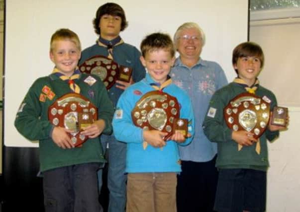 Winners of the 1st Angmering Scouts' annual Yvonne Heater Award are (pictured from left) Thomas Hartigan, Ciaran Murphy, Tristan Pender and Joe Thornton, with Sharon Francis, Yvonne's daughter, who made the presentations