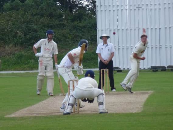 Cameron Smith bowling for Hastings Priory in their win over Roffey on Sunday. Picture by Simon Newstead (SUS-140713-221112002)
