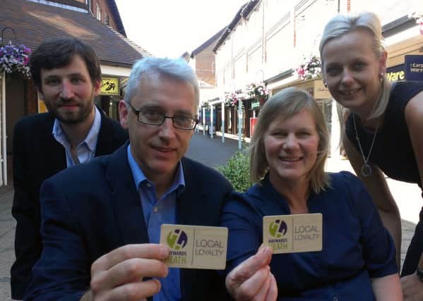 Business owners and members of the Haywards Heath Town Team with the new business loyalty cards