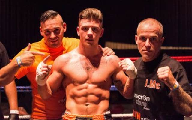 Jamie McGuigan (centre) with Fighting Tigers Gym coaches Andy Chambers (left) and Phil Eaton (right). Picture courtesy Free the Light Company