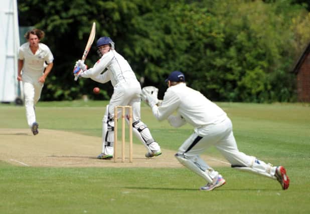 Bexhill wicketkeeper Jack Richardson gathers a Joe Cox delivery during last weekend's draw at Horsham. Picture by Steve Cobb (SUS-140714-104743001)