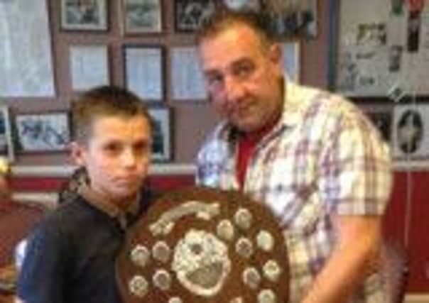 Toby Salmon receives his shield from George Doolen at West Hill ABC's annual end-of-season presentation night