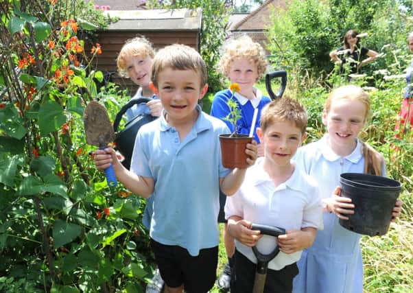 Some of St Marys CE Primary Schools gardening gurus with their crops                                            D14301326a