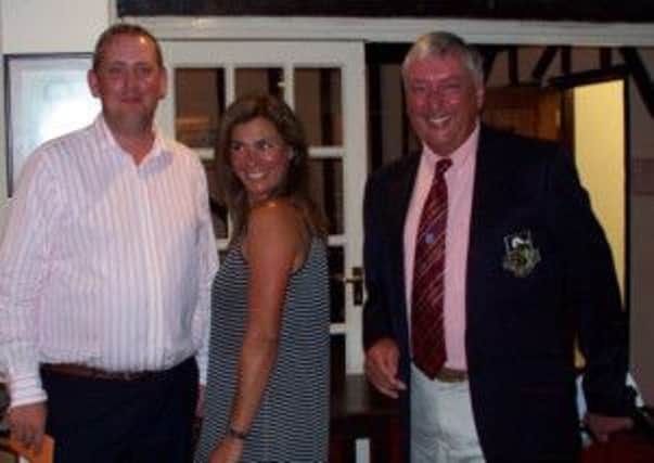 Haywards Heath Golf Club Mixed Evening Fours, Adam Cattell and Liz Killick, being presented with their prizes by Derek May, Club Captain.
