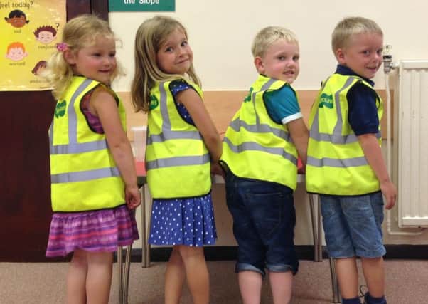 Big smiles as these children in Rustington try on their new vests SUS-140721-143804001