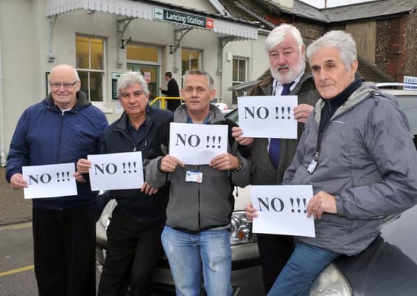 Sean Ridley, centre, with other hackney carriage drivers opposing the increase W51370H13