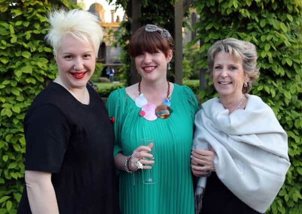 Phoebe with Vanessa Sanchez, left, and Gillian Guirrieic of Harvey Moon, who are sponsoring the burlesque evening.