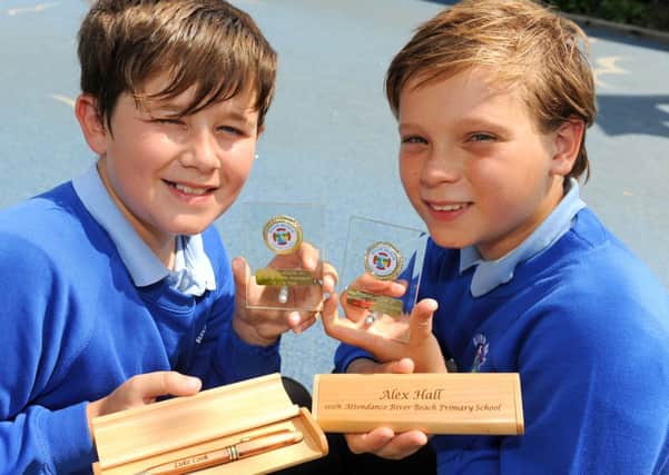 Luke Cook, left, and Alex Hall, both 11, have been presented with awards for not missing a single day of school   for six years                                                                                                                                                        D14302016a
