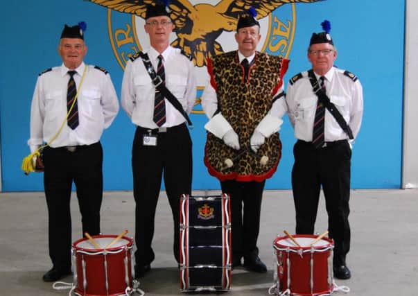 Left to right, Brian White from Worthing, Richard Newman from Southwick, Ken Towner from Ferring and Barry McCann from Southwick. Below, the band at drill practice