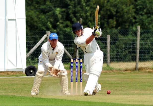 Clive Tong goes on the drive for Crowhurst Park against Worthing in Sussex Cricket League Division Two on Saturday. Picture by Steve Hunnisett (SUS-140726-165251002)