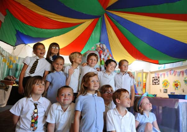 Brightly-coloured drapes in the prayer spaces at St Margarets CE Primary School, Angmering      D14301022a