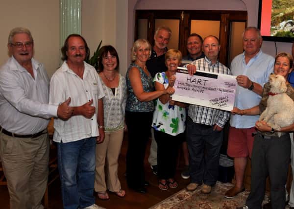 HENFIELD HART Three Peaks Team members and supporters celebrate raising £4,800 at the White Hart on Friday. Pic Mike Beardall, Oakfield Media SUS-140729-104550001