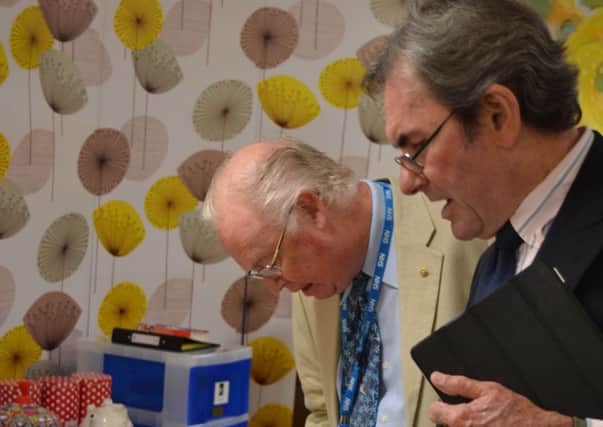 Non-executive director Bill Brown and trust governor David Langley look at reminiscence pod designed for patients with a dementia