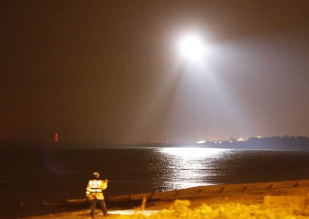 Coastguards using their search light during the rescue         PICTURE: Eddie Mitchell