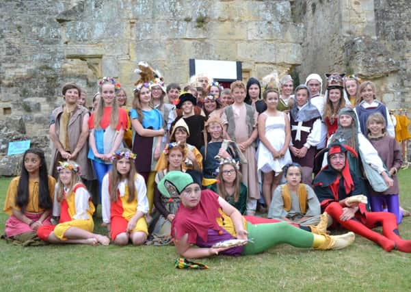 Claremont School production of Tales of a Travelling Troupe at Bodiam Castle SUS-140730-114347001
