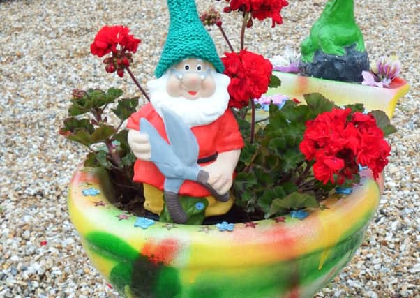 The youngsters at Fairlights Activate Youth Club made this gnome, placing him in splendour on his garden throne, earlier in the summer, and now he spends his time on days out around the village, though he only goes where he wants to go. SUS-140508-101321001