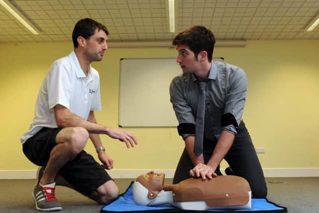 Gazette chief reporter Tom Cotterill, above, used his first aid skill to give CPR. Pictured with Mike Mole, left