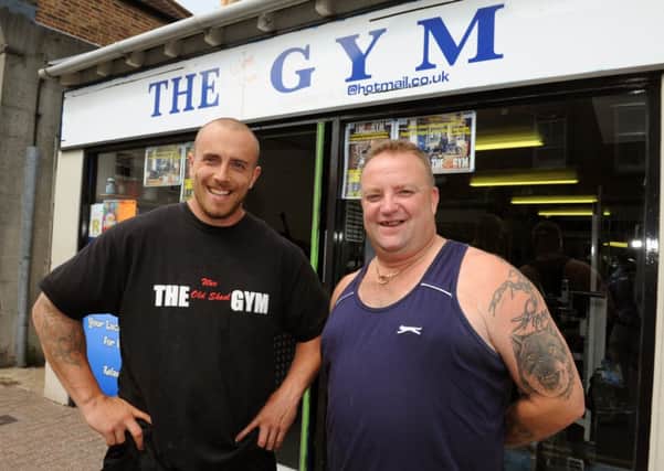 LG 010814  The Wee Old Skool Gym, in Arcade Road, Littlehampton. Owner Chris Smith left is hosting a free, charitable gym session twice a week, pictured with Cllr Ian Buckland. Photo by Derek Martin SUS-140108-174713001