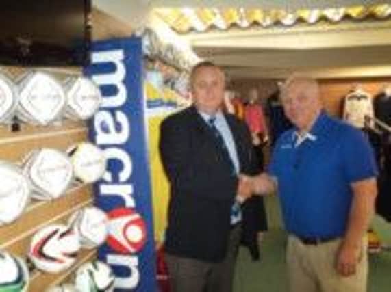 Sussex County Football League chairman Steve Nealgrove (left) and Terry Henham, of Macron Store Hastings