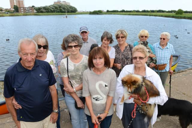 WH 050814 Majorie Wright and members of Brooklands Wildlife Support group campaigning for the lake to be dredged to stop infestation of blue green algae. Photo by Derek Martin SUS-140608-004149001