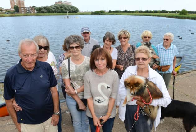 WH 050814 Majorie Wright and members of Brooklands Wildlife Support group campaigning for the lake to be dredged to stop infestation of blue green algae. Photo by Derek Martin SUS-140608-004149001