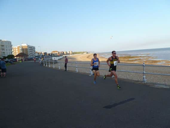 Nick Duggan and Max Thomas vie for the lead in the final Bexhill 5K Seafront Series race. Picture by Simon Newstead (SUS-140108-103809002)