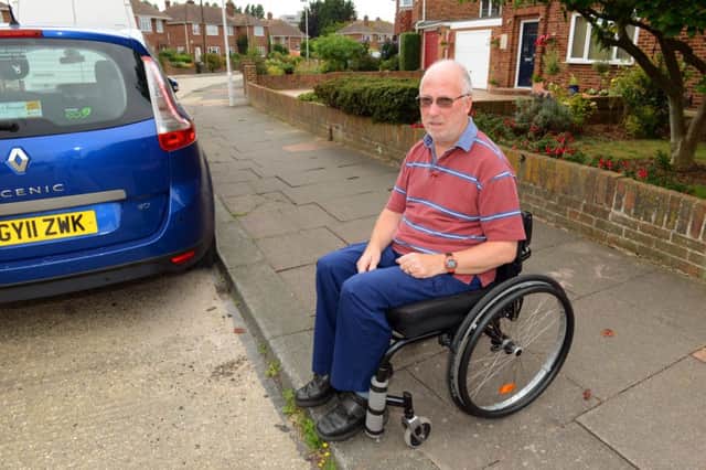 WH 050814 Phil Burton has been turned down for a disabled parking bay outside his house. Photo by Derek Martin SUS-140608-005546001