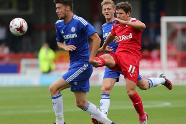Josh Simpson scores Crawley Town's second goal during their 3-2 defeat by Chelsea SUS-140408-212346002