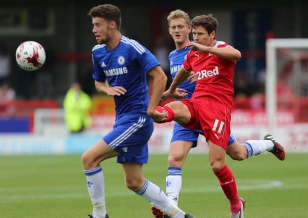 Josh Simpson scores Crawley Town's second goal during their 3-2 defeat by Chelsea SUS-140408-212346002