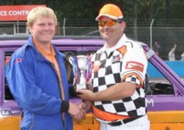 Tim James collects another Destruction Derby title and trophy