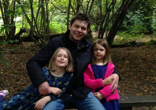 Tim Farmer with his two daughters