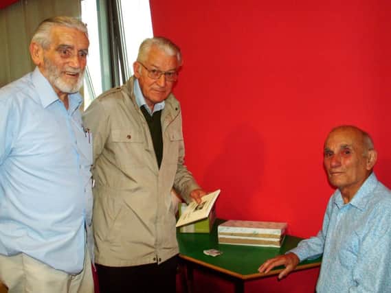 John Pratt signs books for Peter Cole and Peter Carey at Bexhill Museum August 2014 SUS-140814-102715001