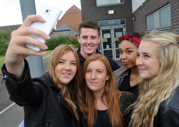 'Hold on, let me take a selfie' - Angmering A-level student pose to take their picture following today's results  L33512H14