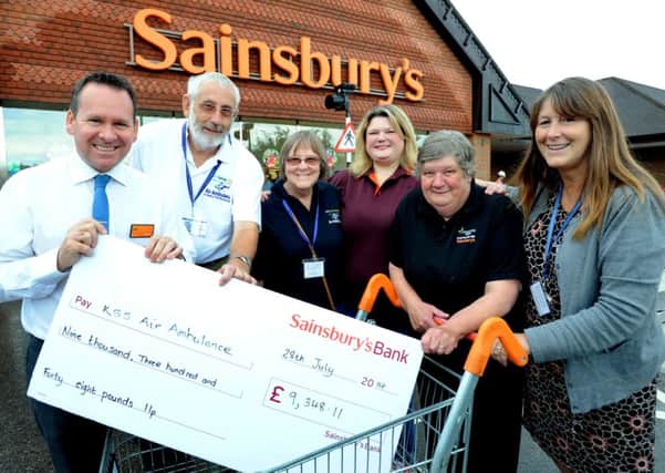 Sainsburys Haywards Heath donate nearly £10,000 to KSS Air Ambulance. Pic Steve Robards SUS-140728-171737001