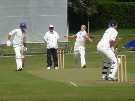 Dean Crawford bowling for Bexhill against Roffey at The Polegrove on Saturday. Picture by Simon Newstead (SUS-140816-232508002)