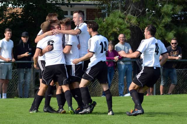Bexhill United celebrate scoring in their Peter Bentley League Cup clash away to crosstown rivals Little Common last weekend. Picture by Stephen Curtis (SUS-140817-124400002)