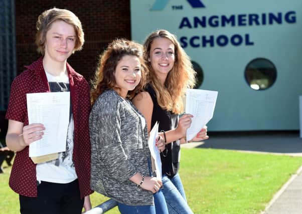 Pupils at The Angmering School collect their GCSE results. Pictured  L-R George Finch, 16, Gena Matthews, 16, and Gemma Charman, 16