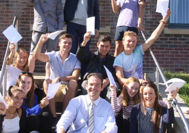 Seaford Colllege students getting their GCSE results 2014 with headmaster John Green (submitted).