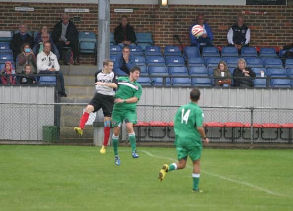 Dave Brown (white/black) scored for Horsham YM. Picture by Clive Turner