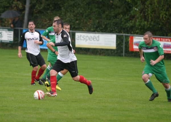 Dan Sullivan foreground for Horsham YM (white/black). Picture by Clive Turner
