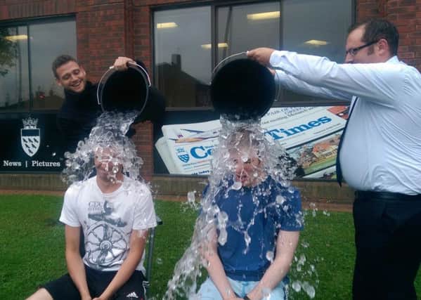 Harley Tamplin and Joshua Powling get covered in ice by colleagues Simon Robb and Mark Dunford