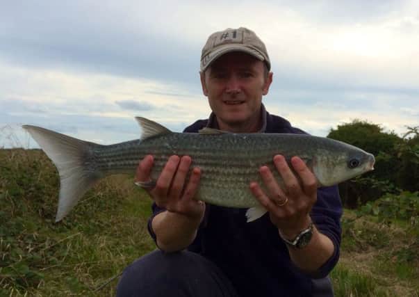 Jon Pearce with his fish SUS-140828-165748001