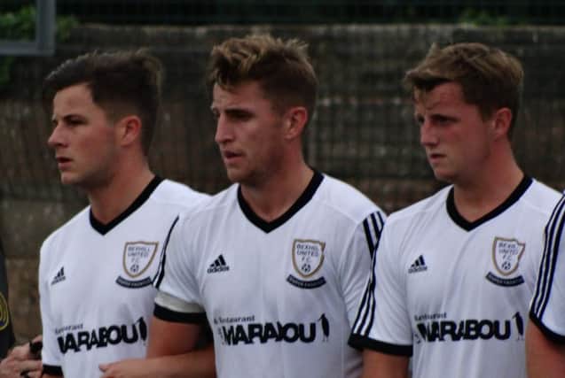 Anthony Cooper (left), Jack Aston (centre) and George Aston (right) form a defensive wall for Bexhill United during their defeat away to Lancing. Picture courtesy Mark Killy