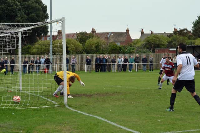 Dave Cook (out of picture) scores Hastings United's winner against Eastbourne United AFC on Saturday. Picture by Stephen Curtis (SUS-140831-215236002)