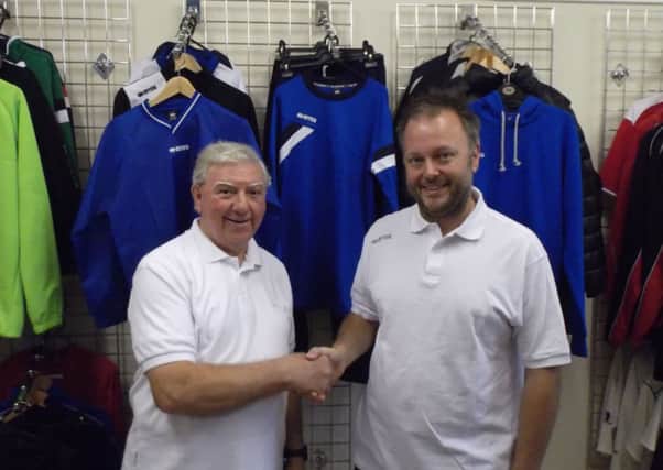 League Secretary John Edwards (left) & Ian Robinson Director of Winning Look pleased to shake hands on new partnership